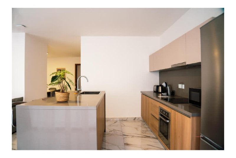 Modern kitchen with island in a HostMT apartment